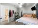Bedroom featuring ceiling fan, mounted TV, study desk and whimsical decorations at 5950 Pacific Shores Dr, Las Vegas, NV 89142