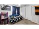 Bedroom featuring futon, arcade console, and novelty wall hangings at 5950 Pacific Shores Dr, Las Vegas, NV 89142