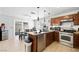 Functional kitchen with granite countertops, stainless steel appliances, and a dining area at 5950 Pacific Shores Dr, Las Vegas, NV 89142