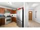 Well-lit kitchen with stainless steel appliances and wood cabinetry at 5950 Pacific Shores Dr, Las Vegas, NV 89142
