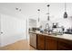 Bright kitchen features pendant lights, stainless steel appliances, and granite countertops at 5950 Pacific Shores Dr, Las Vegas, NV 89142