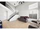 Bright and airy living area showcasing staircase, tile floors, and natural light at 5950 Pacific Shores Dr, Las Vegas, NV 89142
