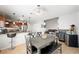 Open concept kitchen and dining space with tile floors, modern appliances, and dining table at 5950 Pacific Shores Dr, Las Vegas, NV 89142