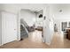 Bright, open living room with tile floors, high ceilings, staircase, and comfortable seating at 5950 Pacific Shores Dr, Las Vegas, NV 89142