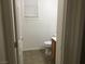 This bathroom features a toilet and a small vanity with a light wood finish at 6416 Pronghorn Ridge Ave, Las Vegas, NV 89122