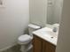 This bathroom features a toilet and a vanity with a light wood finish at 6416 Pronghorn Ridge Ave, Las Vegas, NV 89122