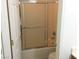 Bathroom featuring a tub and shower with glass doors at 6416 Pronghorn Ridge Ave, Las Vegas, NV 89122