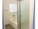 Bathroom featuring a shower and bath tub, with a window above the tub at 6416 Pronghorn Ridge Ave, Las Vegas, NV 89122