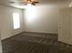 A large bonus room with carpet flooring at 6416 Pronghorn Ridge Ave, Las Vegas, NV 89122