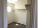 Spacious walk-in closet featuring neutral carpeting and ample shelving at 6416 Pronghorn Ridge Ave, Las Vegas, NV 89122