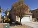 Inviting two-story home with a two-car garage and desert landscaping at 6416 Pronghorn Ridge Ave, Las Vegas, NV 89122