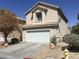 Beautiful two-story home with a two-car garage and desert landscaping at 6416 Pronghorn Ridge Ave, Las Vegas, NV 89122