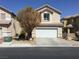 Charming two-story home with a two-car garage and desert landscaping in front at 6416 Pronghorn Ridge Ave, Las Vegas, NV 89122