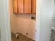 The laundry area features overhead cabinets and tile flooring at 6416 Pronghorn Ridge Ave, Las Vegas, NV 89122