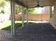 Relaxing covered patio with a ceiling fan and a view of the grassy backyard at 6416 Pronghorn Ridge Ave, Las Vegas, NV 89122