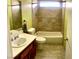 Bathroom featuring a single sink vanity and tub shower at 6429 Rosemount Ave, Las Vegas, NV 89156