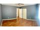 Bedroom with gray walls and hardwood floor at 6429 Rosemount Ave, Las Vegas, NV 89156
