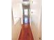 Bright hallway with beautiful hardwood flooring stretches toward a sunlit room, enhancing the home's airy feel at 6429 Rosemount Ave, Las Vegas, NV 89156