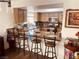 Open kitchen featuring a breakfast bar with seating, modern appliances, and ample counter space at 6429 Rosemount Ave, Las Vegas, NV 89156