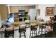 Eat-in kitchen with bar stool seating, granite countertops and stainless steel appliances at 6429 Rosemount Ave, Las Vegas, NV 89156