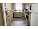 A traditionally styled kitchen featuring wooden cabinets, countertops, and stainless steel appliances at 6429 Rosemount Ave, Las Vegas, NV 89156