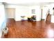 Spacious living room with hardwood floors, white walls, and natural light, awaiting personal touches and decor at 6429 Rosemount Ave, Las Vegas, NV 89156