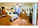 Spacious main bedroom with wooden floors, dressers, sitting chair and ample natural light at 6429 Rosemount Ave, Las Vegas, NV 89156