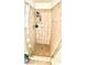 Tiled shower featuring glass door and tiled floor at 6429 Rosemount Ave, Las Vegas, NV 89156