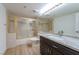 Bathroom with gold-framed shower, a toilet, and a vanity with gray granite countertops at 7625 Spanish Bay Dr, Las Vegas, NV 89113