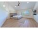 Serene bedroom with a platform bed, hardwood floors, and large windows at 7625 Spanish Bay Dr, Las Vegas, NV 89113