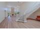 Open-concept foyer with a staircase leading to the upper level and a view of the living room at 7625 Spanish Bay Dr, Las Vegas, NV 89113