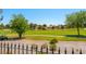 Backyard view of the golf course, landscaping, and other homes in the neighborhood at 7625 Spanish Bay Dr, Las Vegas, NV 89113