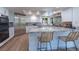 Modern kitchen with stainless steel appliances, granite countertops, and a breakfast bar at 7625 Spanish Bay Dr, Las Vegas, NV 89113