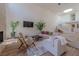 Spacious living room with a staircase, modern decor, and plenty of natural light at 7625 Spanish Bay Dr, Las Vegas, NV 89113