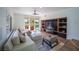 Comfortable living room with built-in shelves and a view of the backyard and pool at 7625 Spanish Bay Dr, Las Vegas, NV 89113