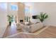 Bright living room boasts high ceilings, modern fireplace, and seamless indoor-outdoor flow to the pool area at 7625 Spanish Bay Dr, Las Vegas, NV 89113