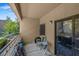 The private balcony has seating and views of the landscaping at 8250 N Grand Canyon Dr # 1123, Las Vegas, NV 89166