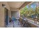 Enjoy outdoor living on the balcony with a chair, small table, and nearby foliage at 8250 N Grand Canyon Dr # 1123, Las Vegas, NV 89166