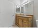 Bathroom with a single sink vanity, large mirror, and tile flooring at 8250 N Grand Canyon Dr # 1123, Las Vegas, NV 89166