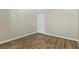 This empty bedroom boasts wood floors, natural light, and a modern color scheme at 8250 N Grand Canyon Dr # 1123, Las Vegas, NV 89166