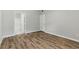 Bedroom with wood flooring, closet, and window at 8250 N Grand Canyon Dr # 1123, Las Vegas, NV 89166