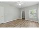 Bedroom with wood flooring, ceiling fan, closet, and window at 8250 N Grand Canyon Dr # 1123, Las Vegas, NV 89166