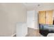 The bedroom has wood floors, an armoire, a freezer, and a door to the room at 8250 N Grand Canyon Dr # 1123, Las Vegas, NV 89166