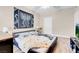 Bedroom featuring modern decor, a ceiling fan, and wood-look flooring at 8250 N Grand Canyon Dr # 1123, Las Vegas, NV 89166