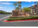 Grand Canyon Village Condominiums entrance sign surrounded by palm trees at 8250 N Grand Canyon Dr # 1123, Las Vegas, NV 89166