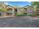 Attractive multi-story condo building with well-maintained landscaping and stairs to upper units at 8250 N Grand Canyon Dr # 1123, Las Vegas, NV 89166
