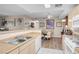 Open kitchen with an adjacent dining area; white appliances at 8250 N Grand Canyon Dr # 1123, Las Vegas, NV 89166
