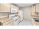 Functional kitchen with white appliances and neutral countertops at 8250 N Grand Canyon Dr # 1123, Las Vegas, NV 89166