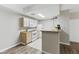 Efficient kitchen with white appliances and a breakfast bar, perfect for casual dining at 8250 N Grand Canyon Dr # 1123, Las Vegas, NV 89166