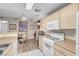 Kitchen area with adjoining dining space and standard appliances at 8250 N Grand Canyon Dr # 1123, Las Vegas, NV 89166